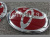 Toyota Corolla (06-10) оригинальные красные эмблемы на капот и заднюю крышку багажника, комплект 2 шт.