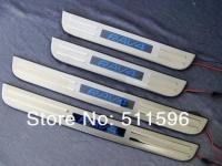 Toyota RAV4 (2006-2012) накладки порогов дверных проемов из нержавеющей стали с подсветкой, комплект 4 шт.