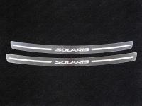 Hyundai Solaris (14–) Накладка на задний бампер (лист зеркальный надпись Solaris) (только седан)
