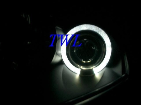 Mitsubishi Eclipse (00-05) передние линзовые фары черные, со светящимися ободками, комплект 2 шт.