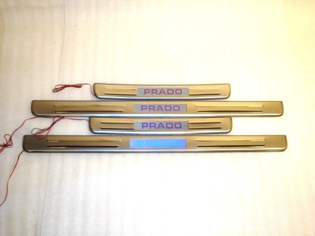 Toyota Land Cruiser Prado 120 (02-09) накладки на пороги дверных проемов, из нержавеющей стали с подсветкой Prado, комплект 4 шт.