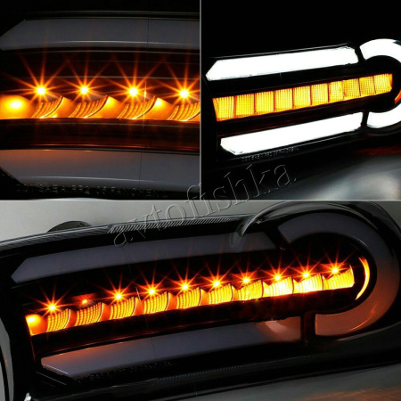Toyota FJ Cruiser (07-14) черные светодиодные динамические поворотники с ДХО, комплект 2 шт.