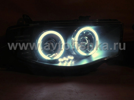 Mitsubishi L200 Triton (2005-) передние фары линзовые со светящимися ободками, черные, комплект 2 шт.