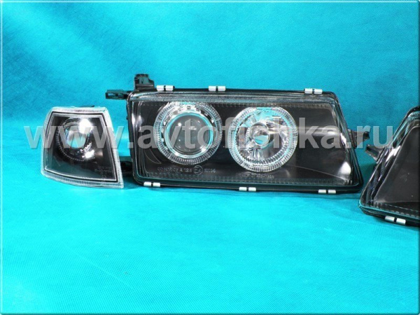 Opel Vectra A (89-95) фары передние линзовые черные, со светящимися ободками, с поворотниками, комплект 2 шт.