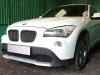 BMW X1 (09–12) Защита радиатора Premium, чёрная (3D)