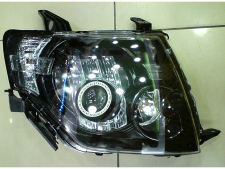 Mitsubishi Pajero 4 (2006-) фары передние линзовые черные со светящимися ободками под электрокорректор, комплект 2 шт.