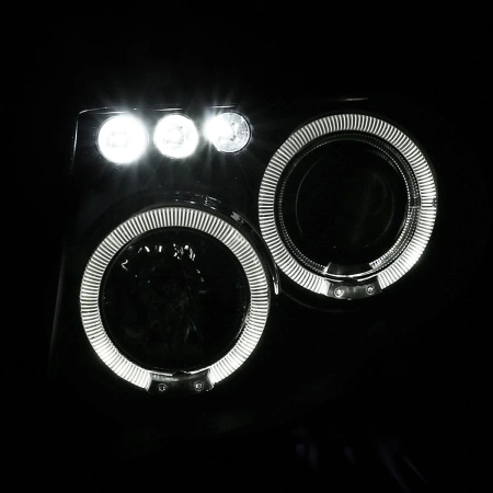 Nissan Pathfinder III, Navara (05-10) фары передние линзовые черные, со светящимися ободками, комплект 2 шт.