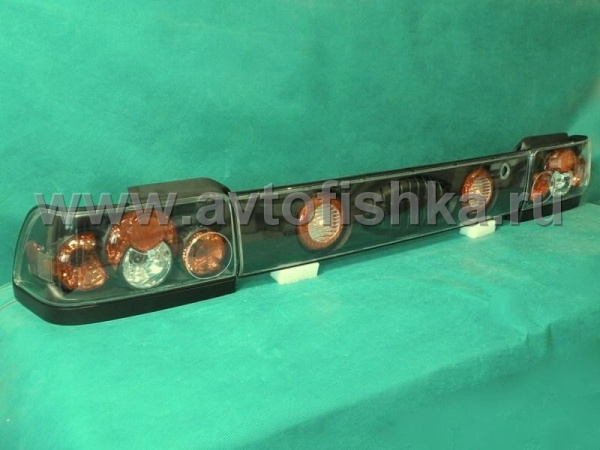 Toyota Corolla (92-97) фонари задние черные со средней накладкой, комплект 3 пр.