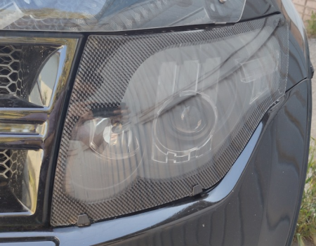 Защита передних фар прозрачная с серой окантовкой Mitsubishi Pajero 2007-