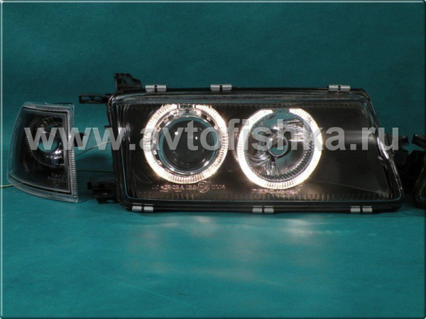 Opel Vectra A (89-95) фары передние линзовые черные, со светящимися ободками, с поворотниками, комплект 2 шт.