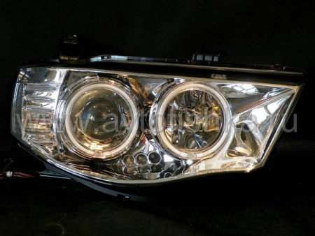 Mitsubishi L200 Triton (2005-) фары передние линзовые хромированные, со светящимися ободками, комплект 2 шт.