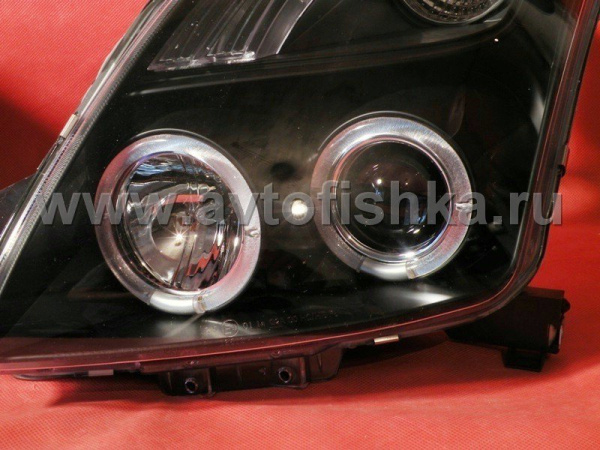 Toyota Yaris P2 (05-) фары передние линзовые черные, со светящимися ободками, комплект 2 шт.
