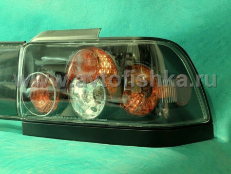 Toyota Corolla (92-97) фонари задние черные со средней накладкой, комплект 3 пр.