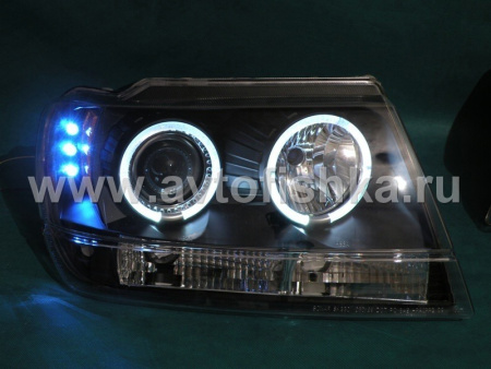 Jeep Grand Cherokee (99-04) передние фары линзовые черные, со светящимися ободками, комплект 2 шт.