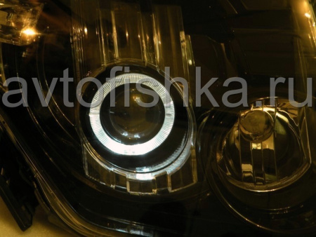 Mitsubishi Pajero 4 (2006-) фары передние линзовые черные со светящимися ободками под электрокорректор, комплект 2 шт.