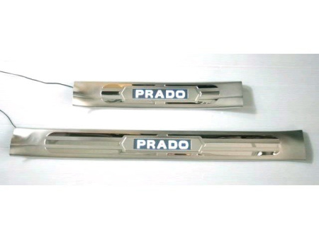 Toyota Land Cruiser Prado 120 (02-) накладки на пороги дверных проемов полированные, из нержавеющей стали с подсветкой Prado, комплект 4 шт.