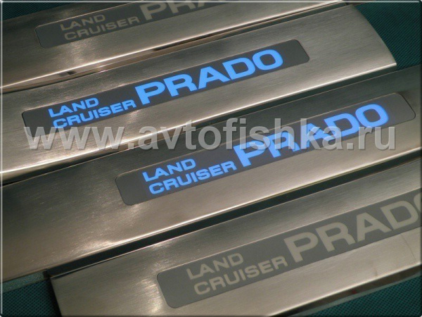Toyota Land Cruiser Prado 120 (02-) накладки на пороги дверных проемов матовые, из нержавеющей стали с подсветкой Prado, комплект 4 шт.