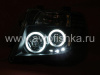 Nissan Pathfinder III, Navara (05-10) фары передние линзовые черные, со светящимися ободками, комплект 2 шт.