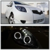 Toyota Yaris P2 (05-) передние фары линзовые черные, со светящимися ободками, комплект 2 шт.
