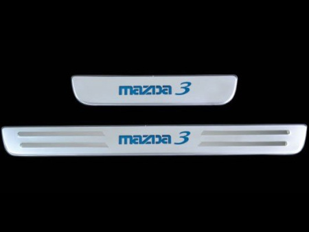 Mazda 3 седан (03-) накладки порогов дверных проемов из нержавеющей стали с подсветкой, комплект 4 шт.