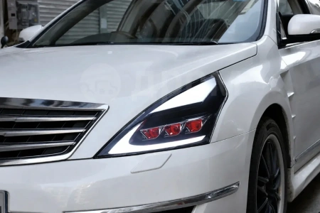 Nissan Teana (08-14) фары передние линзовые черные, с подсветкой DRL, стиль Лексус