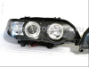 BMW X5 (98-03) фары передние линзовые черные, со светящимися ободками, с электрокорректором, комплект 2 шт.