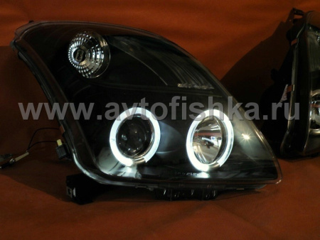 Toyota Yaris P2 (05-) фары передние линзовые черные, со светящимися ободками, комплект 2 шт.