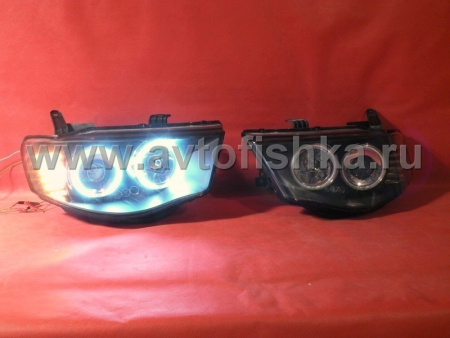 Mitsubishi L200 Triton (2005-) передние фары линзовые со светящимися ободками, черные, комплект 2 шт.